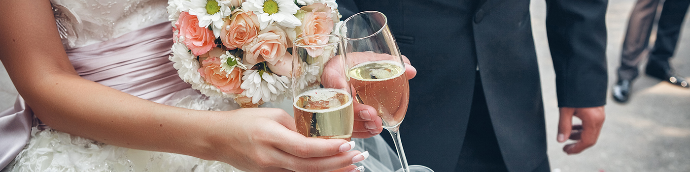 Wedding Couple Holding Champaign Glasses