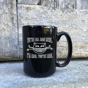 We're All Mad Ceramic Mug